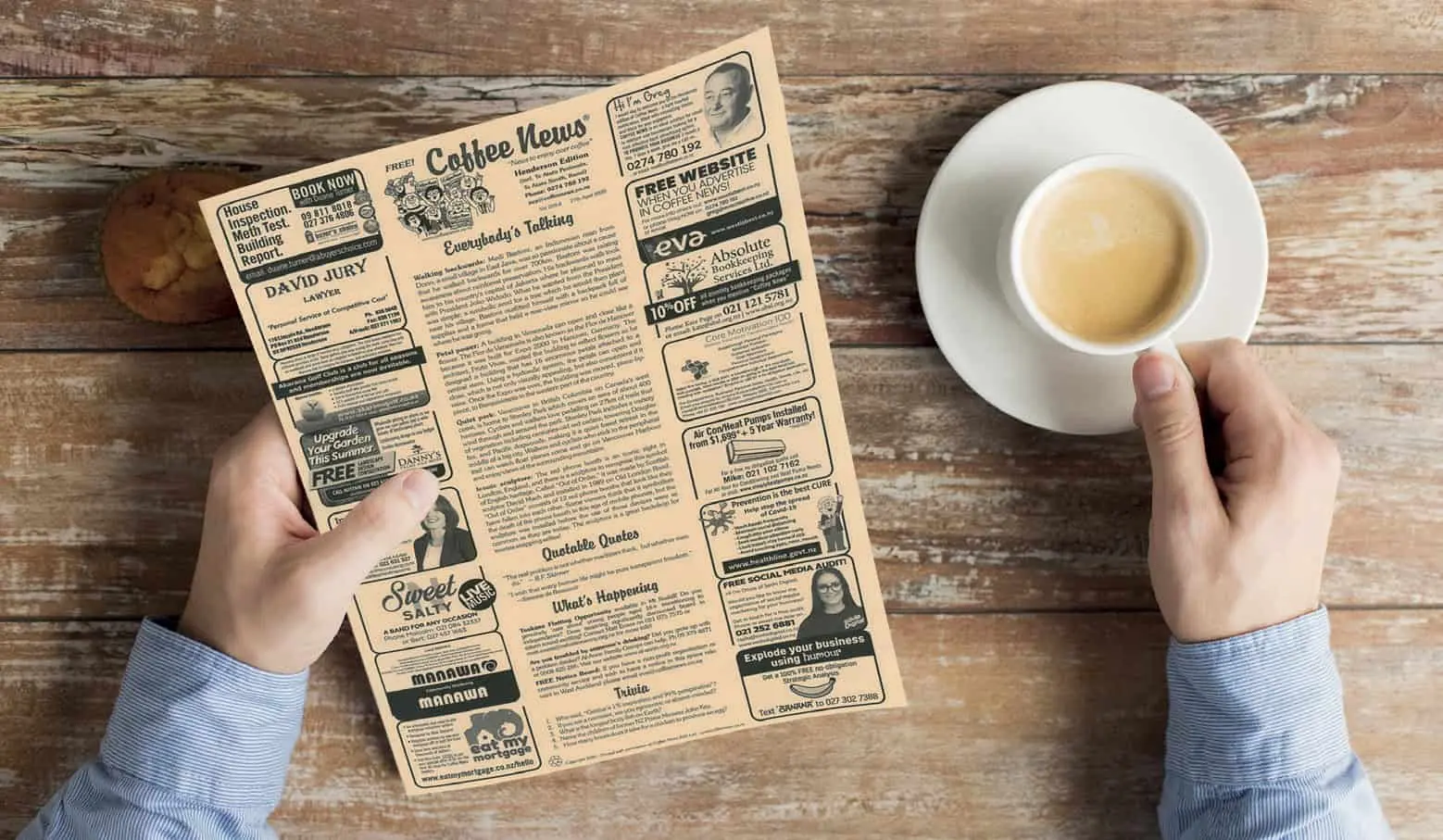 Someone drinking coffee while reading Coffee News